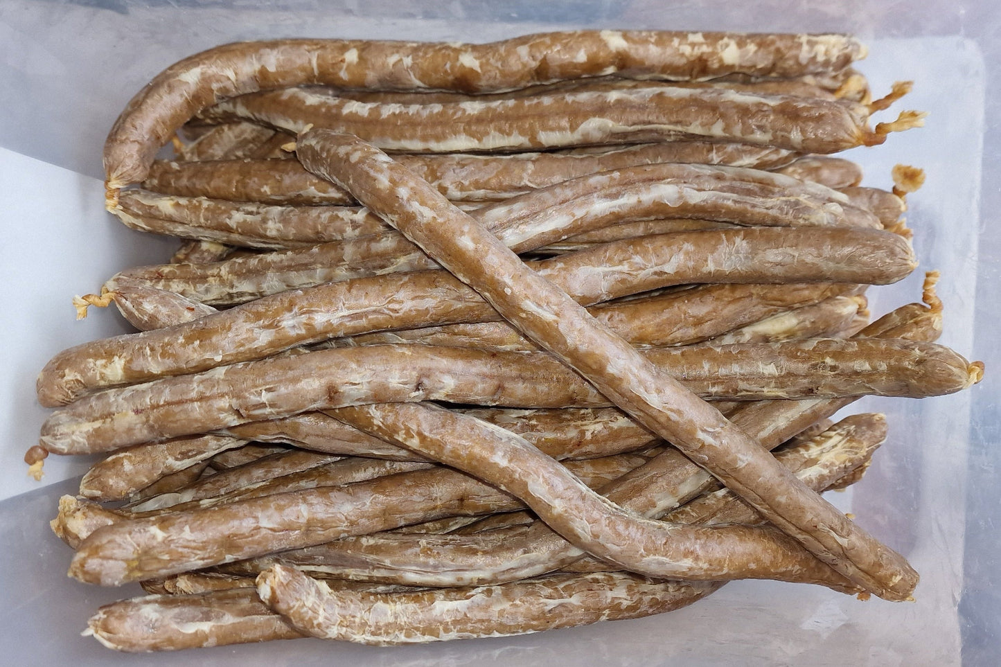 Container of sausages