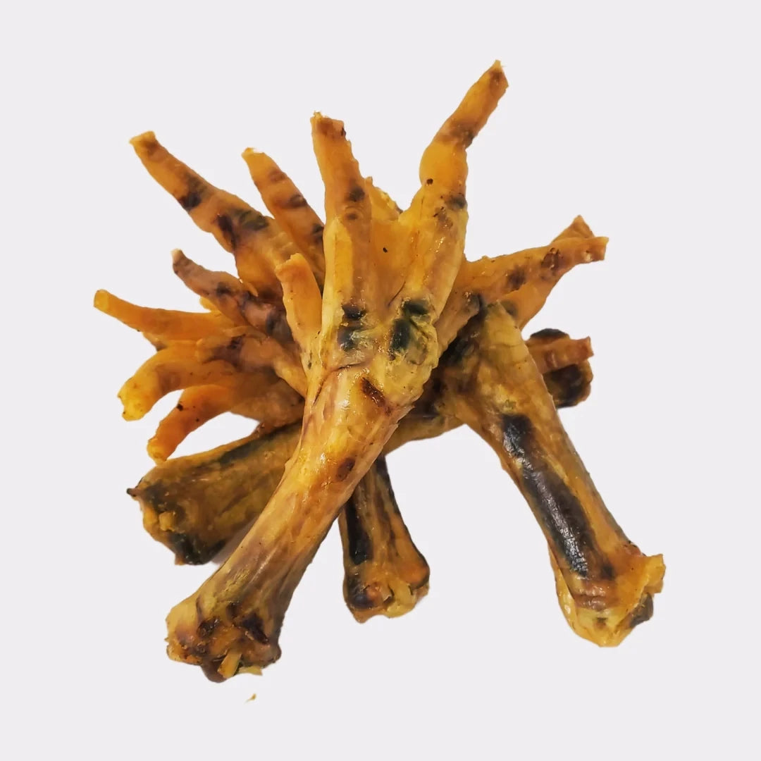 Hilltop Pet Food Chicken Feet - Natural, rich in glucosamine for dogs, stacked on a plain white background.