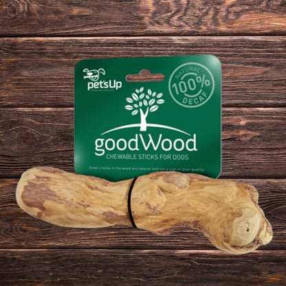 A Hilltop Pet Food goodWood Coffee Wood Chewable Stick for Dogs for dental care on a wooden background.
