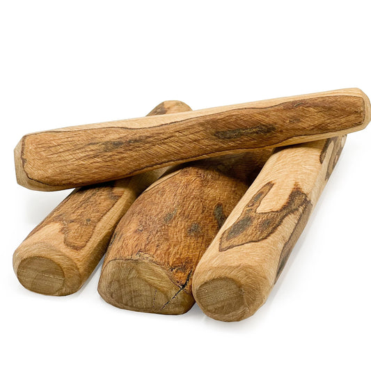 Four Hilltop Pet Food Olive Wood Chews are stacked on a white background, perfect as natural dog chews.
