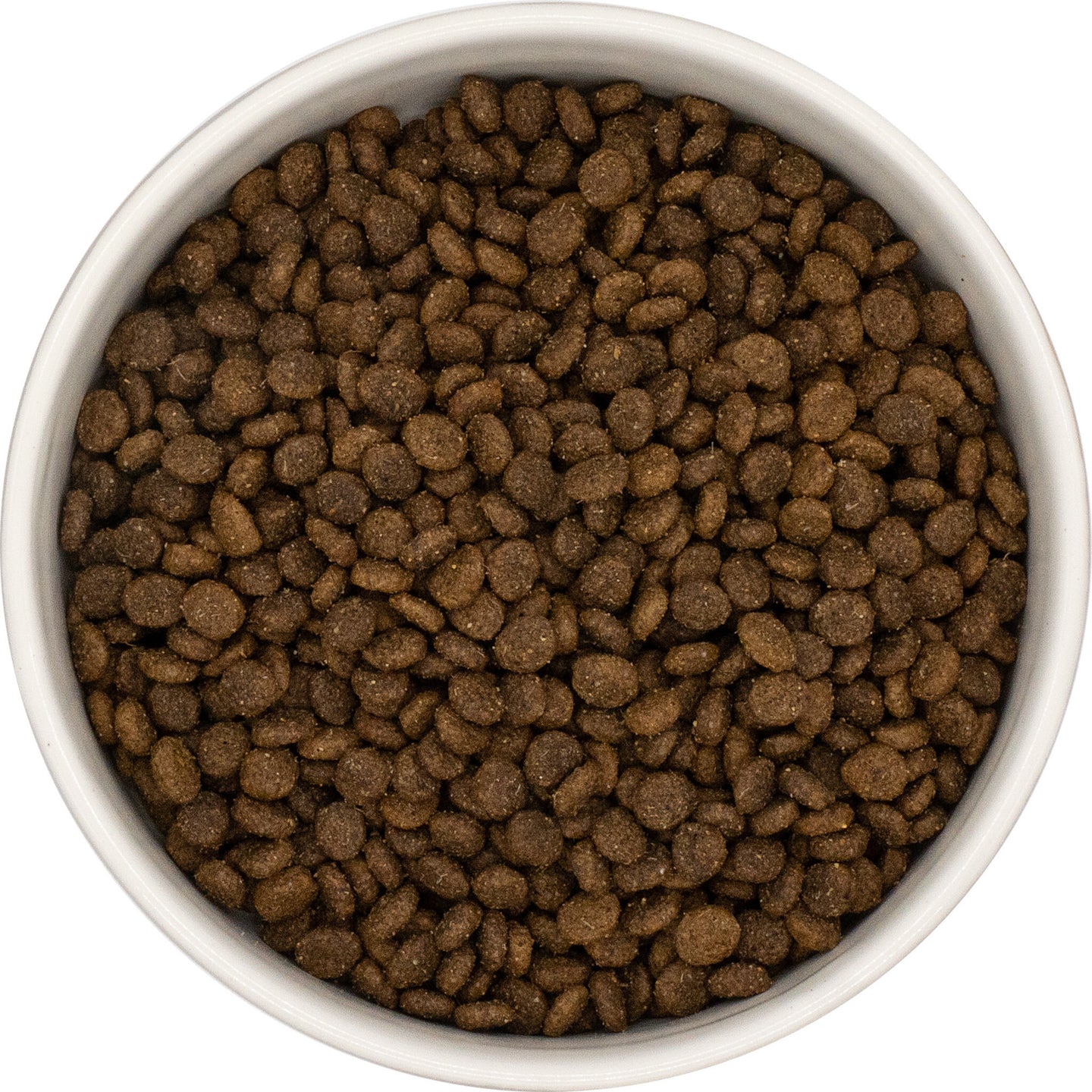 A bowl of Hilltop Grain Free Small Breed Dog Food—Lamb, Sweet Potato & Mint kibble—viewed from above.
