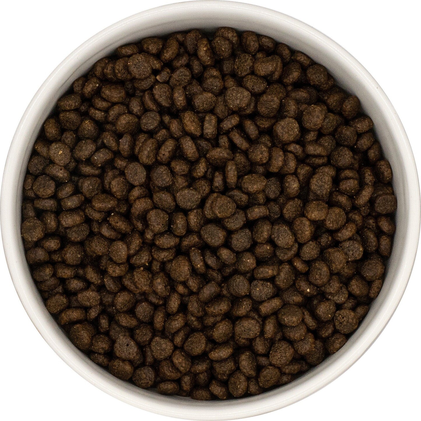A bowl with Hilltop Pet Food Grain Free Small Breed Salmon & Trout kibble, viewed from above.
