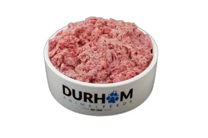A white bowl labeled Hilltop Pet Food with Durham Venison Complete Mince 454g, ideal as natural dog food.