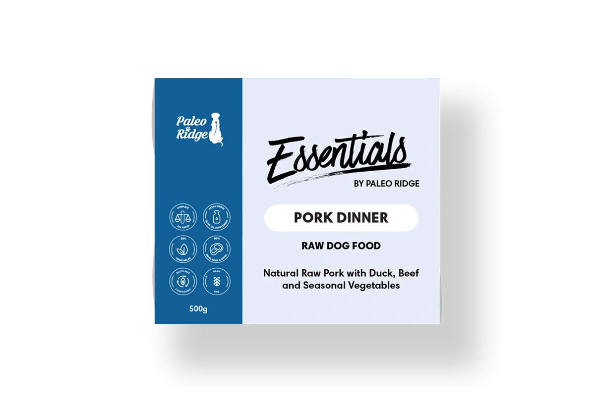 Hilltop Pet Food’s Paleo Ridge: Essentials - Pork Dinner 500g is a grain-free dog food with product info on the box.