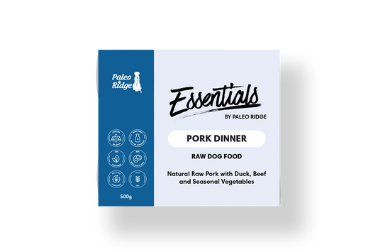 Hilltop Pet Food’s Paleo Ridge: Essentials - Pork Dinner 500g is a grain-free dog food with product info on the box.