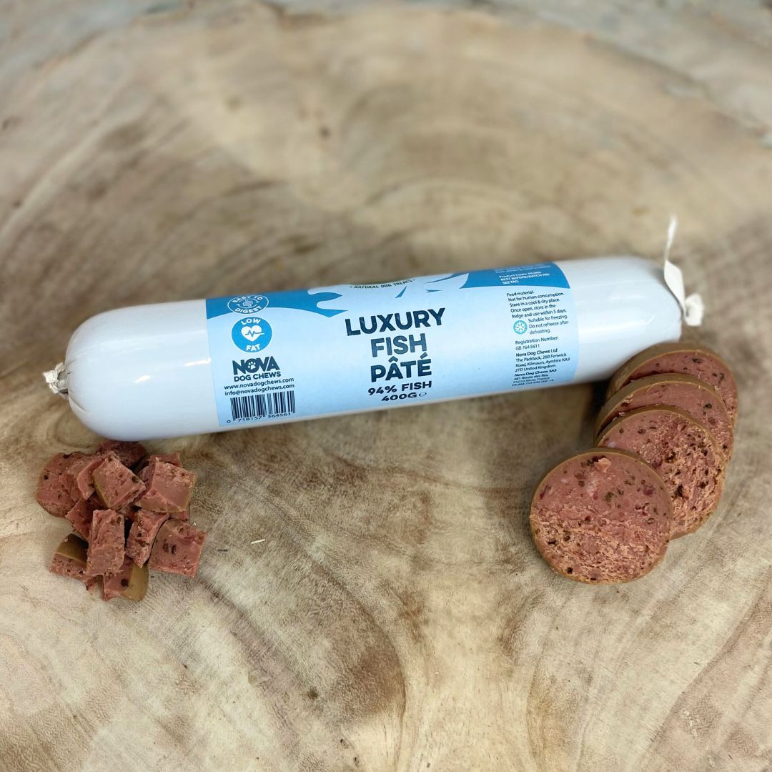 Hilltop Pet Food Paddock Farm Luxury Pâté, a high-protein, low-fat treat for dogs and cats, sliced on wood.