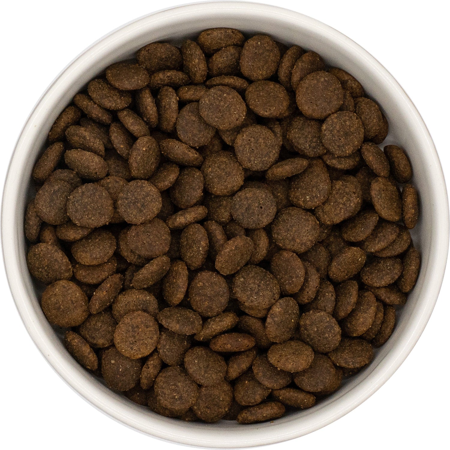 White bowl filled with Hilltop Grain Free Pork, Sweet Potato and Apple dog food on a white background