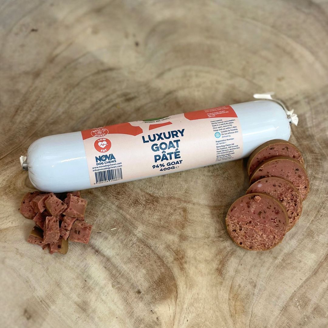 Hilltop Pet Food Paddock Farm Luxury Pâté, a high-protein, low-fat treat for dogs and cats, sliced on wood.
