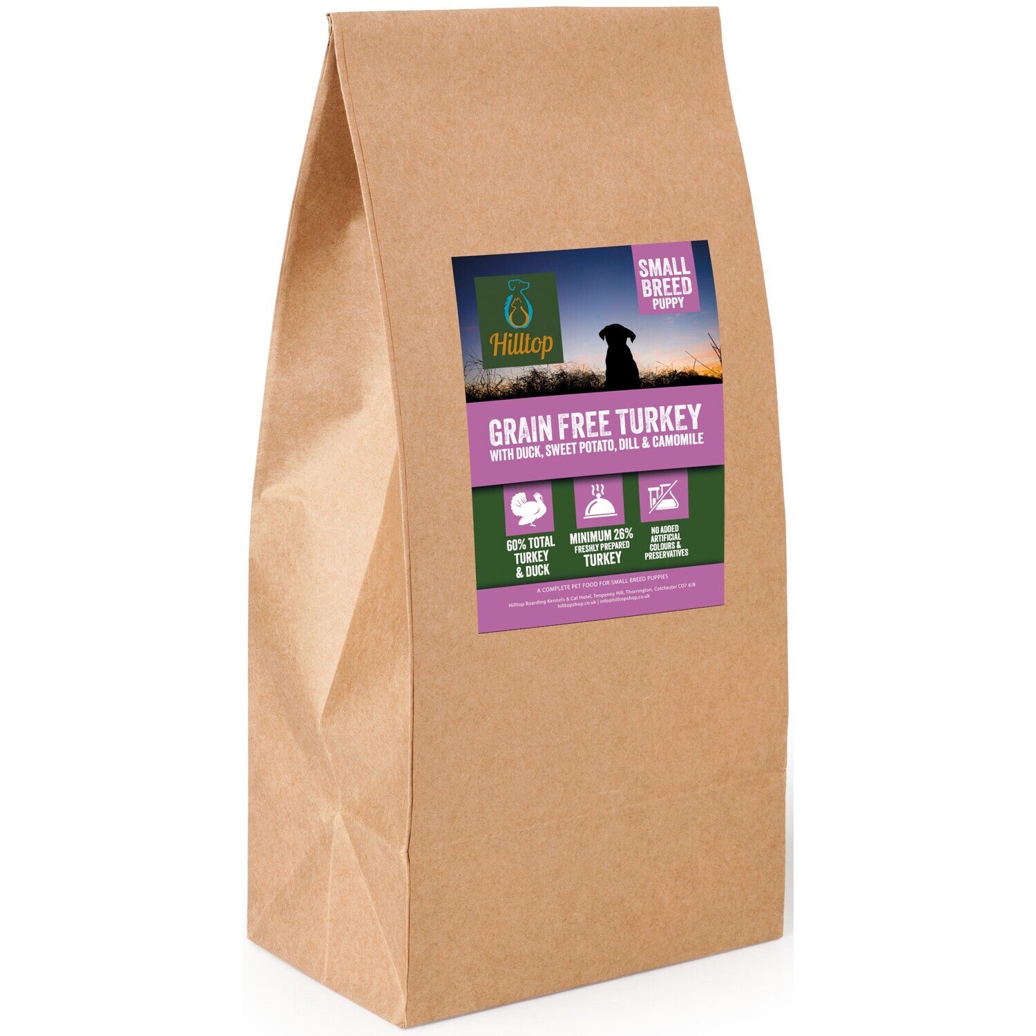 A bag of Hilltop grain free dog food for small breed puppies with turkey, duck, sweet potato, dill, and camomile. Packaging is brown with a label showing the product name and images of a dog and a puppy.