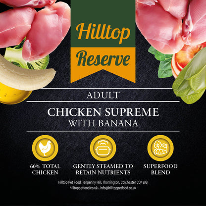 Promotional graphic for Hilltop Reserve Adult Chicken Supreme with Banana, featuring raw chicken pieces, banana, broccoli, and vegetables around a central green and orange logo banner on a dark textured background with product details and three benefit icons.