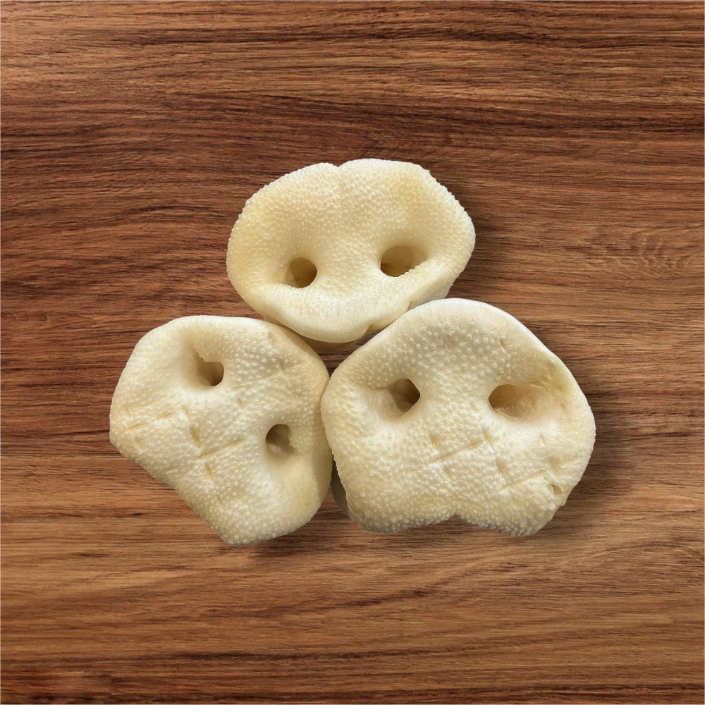 Hilltop Pet Food Puffed Pig Snout is a fun, natural dog treat shaped like a cartoonish, textured nose.