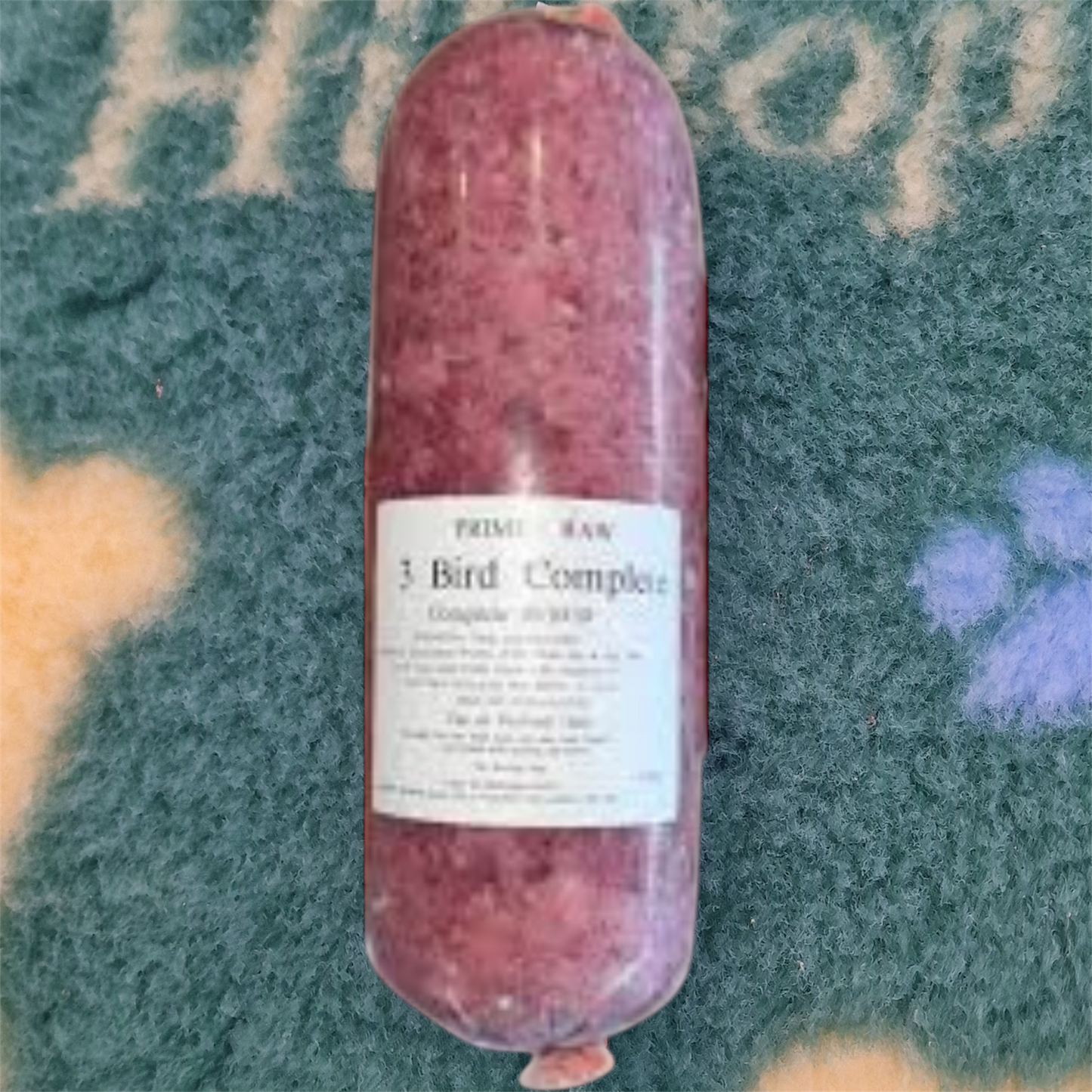 Raw meat product with a label on a textured surface