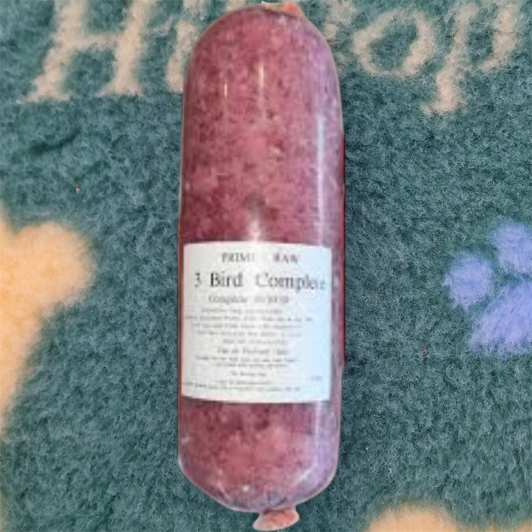 Raw meat product with a label on a textured surface