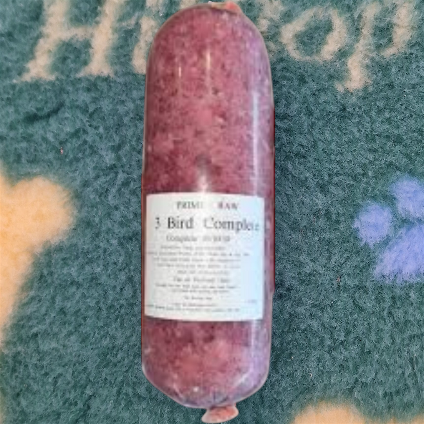Raw meat product with a label on a textured surface
