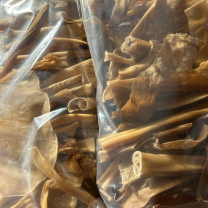Two close up bags of Goat Skin dog treats