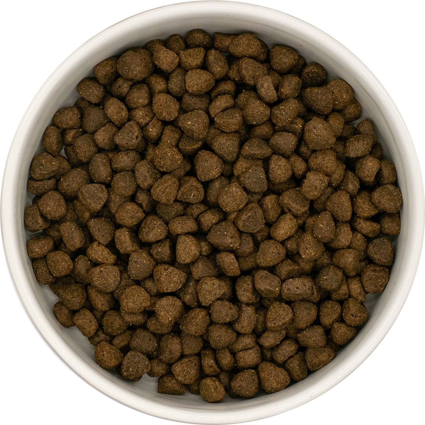 A white bowl of Hilltop Superfood 65 Small Bite Angus Beef dog food, viewed from above.