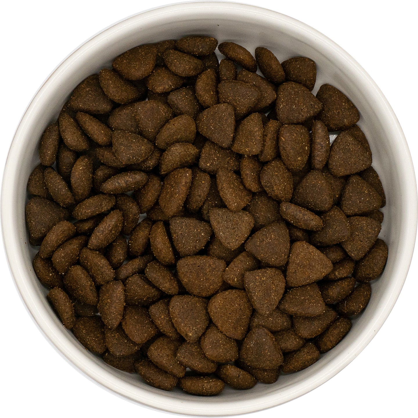 A white bowl filled with Hilltop Superfood 65 Adult Dog Food, British Free Range Chicken kibble, seen from above.