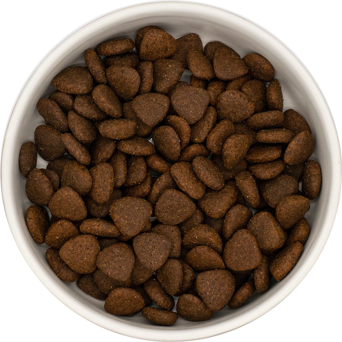 A white bowl of Hilltop Pet Food Superfood 65 Adult Dog Food–English Country Duck, viewed from above.