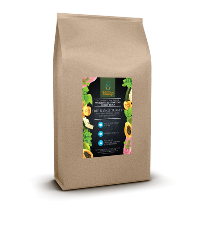 A brown bag of Hilltop Superfood 65 Adult Dog Food with turkey, pork, and superfoods on a black label.