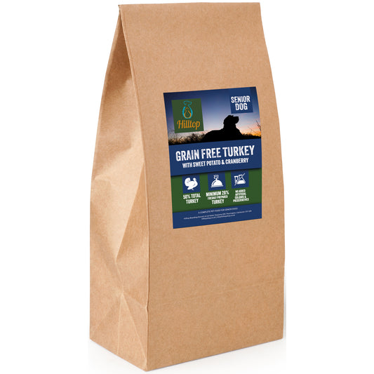 A brown paper bag of Hilltop Grain Free Dog Food Senior - Turkey with Sweet Potato & Cranberry for digestive health.