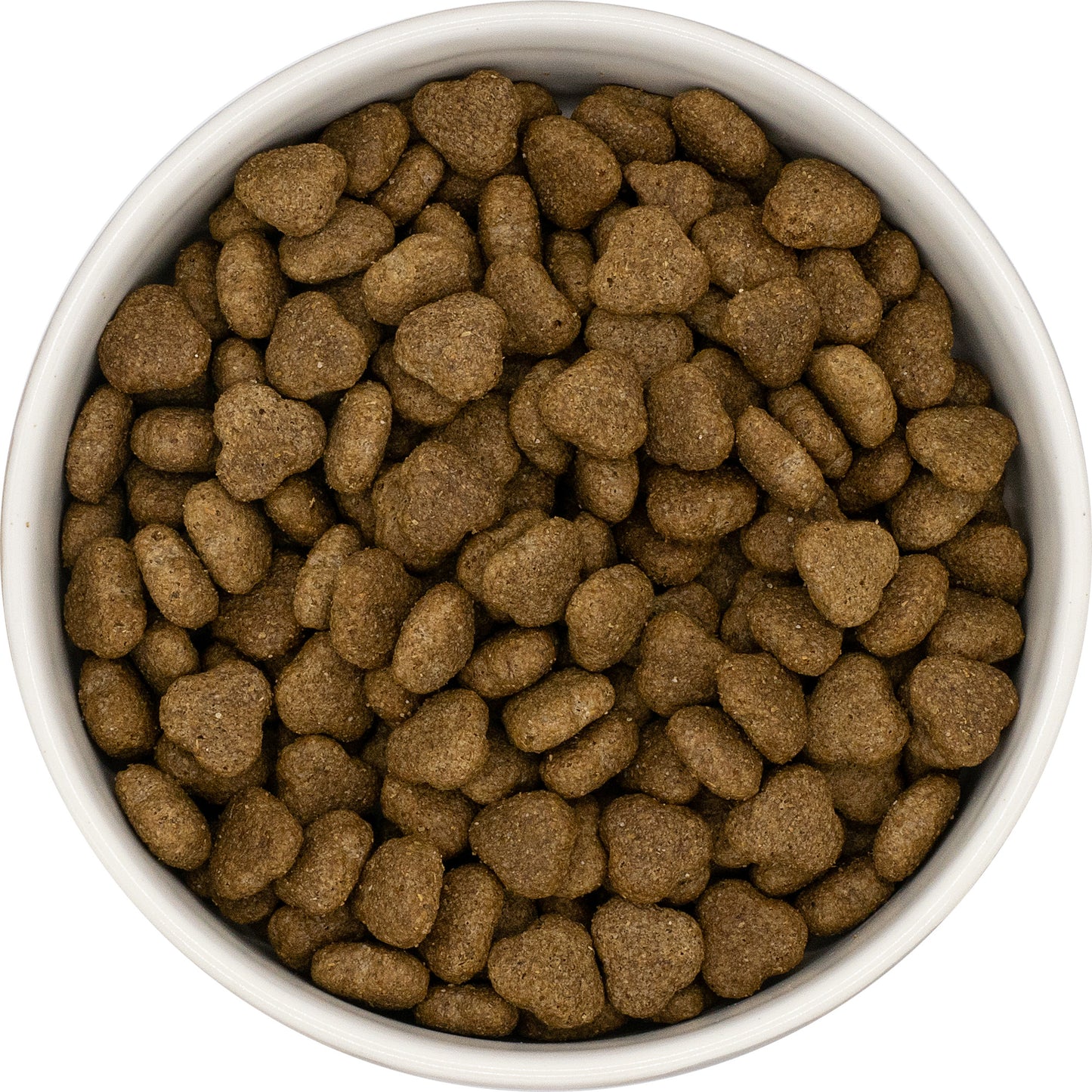 A white bowl filled with Hilltop Super Premium Adult Dog Food - Turkey & Rice kibble, viewed from above.
