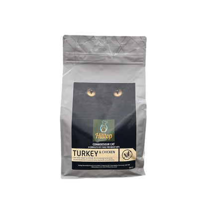 Hilltop Connoisseur Cat Food Adult, Turkey & Chicken by Hilltop Pet Food, features a cat eyes design on the bag.