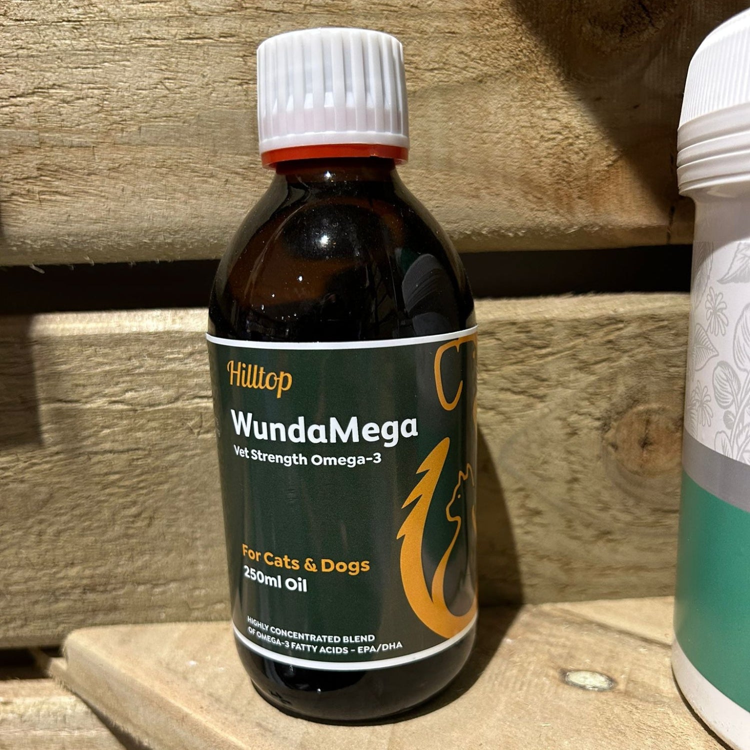 Bottle of WundaMega Omega-3 oil supplement on a wooden shelf