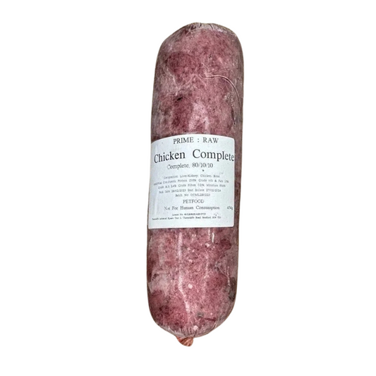 A raw cylindrical roll of Hilltop Pet Food Prime:Raw - Chicken Complete (with lamb offal) with a white front label.