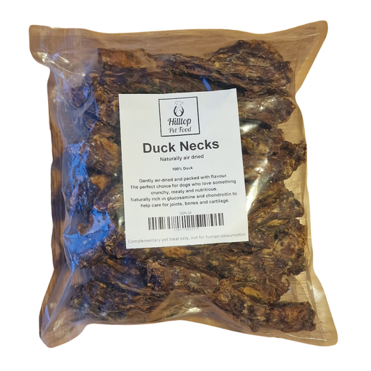 A sealed bag of Hilltop Pet Food Duck Necks - Air Dried with a white label on the front.