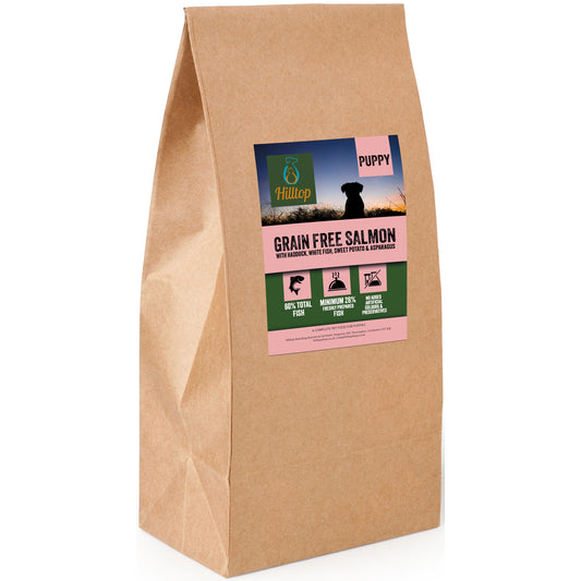 A bag of Hilltop grain-free dog food for puppies, with salmon, haddock, white fish, sweet potato, and asparagus.