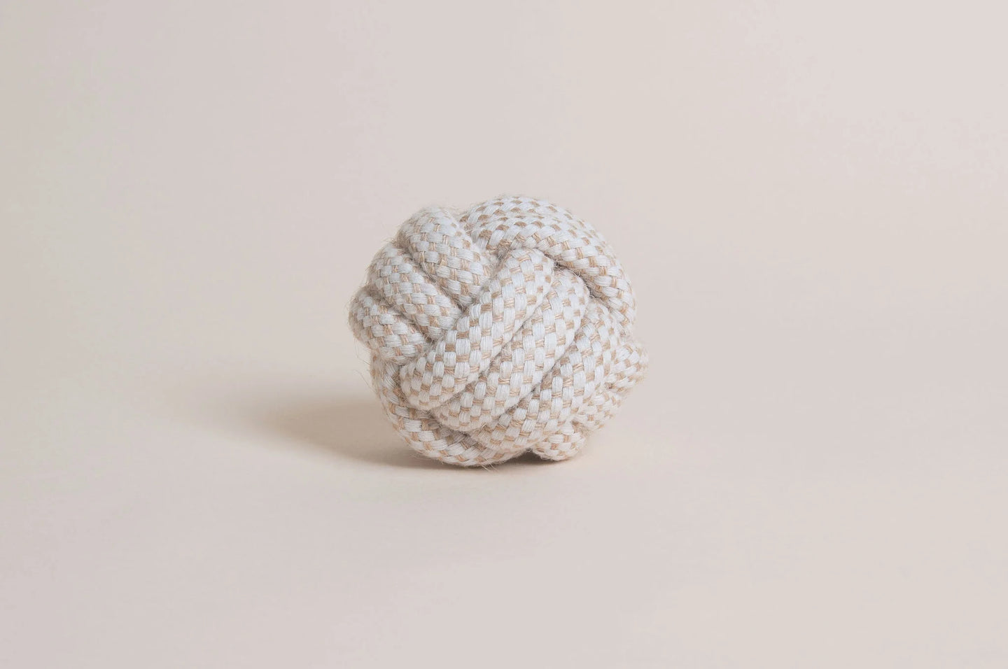 The Hilltop Pet Food Natural Rope Toy - Classic Rope Ball in white and beige rests on a plain light background.