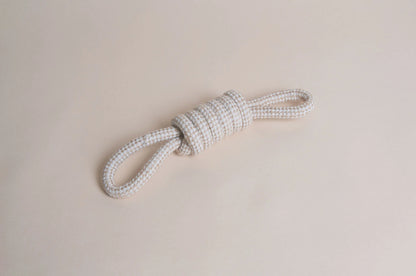 Hilltop Pet Food’s Natural Rope Toy - Bow Tie Tug, tied in a knot, shown on a light beige background.