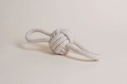 Hilltop Pet Foods Natural Rope Toy - Bow Tie Ball features a white and beige knot with two loose ends on a neutral background.