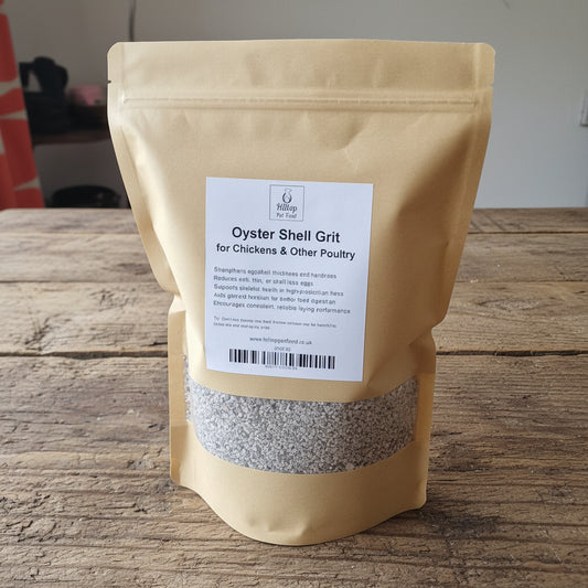 2kg bag of oyster shell grit on a wooden surface