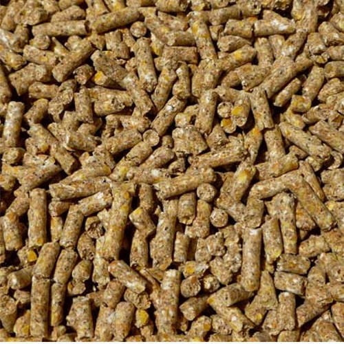 Close-up of Hilltop Pet Food Layers Pellets - 20kg, brown pellets for chicken feed to support egg production.